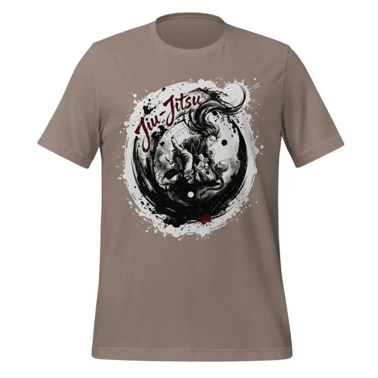 A circular black-and-white graphic featured on a tee displaying a dynamic brushstroke yin-yang motif surrounded by ink splatters. Inside the main circle, a woman with flowing dark hair and a bearded man with a braided ponytail engage in a close-quarters ground grappling sequence. Dark brushwork forms an expressive frame around the scene, with the words "Jiu-Jitsu" layered in a rich red script at the top left and a small red ink accent at the bottom.