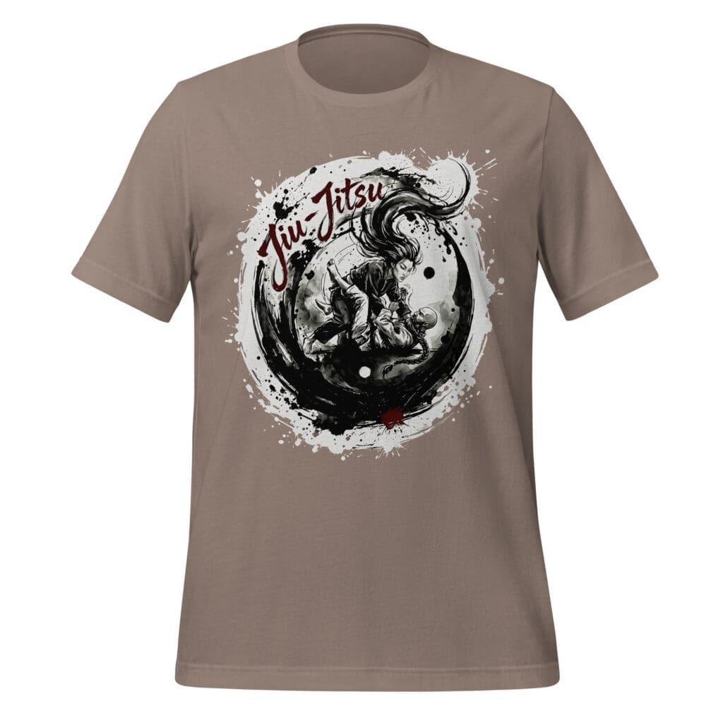 A circular black-and-white graphic featured on a tee displaying a dynamic brushstroke yin-yang motif surrounded by ink splatters. Inside the main circle, a woman with flowing dark hair and a bearded man with a braided ponytail engage in a close-quarters ground grappling sequence. Dark brushwork forms an expressive frame around the scene, with the words "Jiu-Jitsu" layered in a rich red script at the top left and a small red ink accent at the bottom.