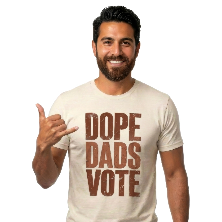 Man wearing a shirt with a close-up graphic design featuring the words DOPE DADS VOTE in tall, bold, terracotta-colored block lettering with heavy distress and cracked texture against a black background.