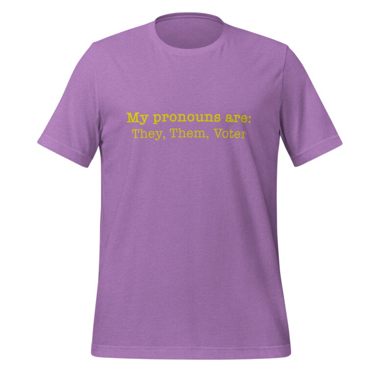 A soft purple t-shirt featuring the text My pronouns are: They, Them, Voter printed in yellow font across the chest.